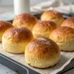 Freshly baked gluten-free potato buns on a wooden board