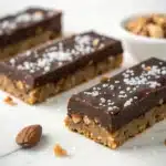 A single perfect Dark Chocolate and Sea Salt Nut Bar (GF) on a clean white background.