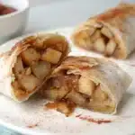 Cross section of a cooked apple pie rice paper roll.